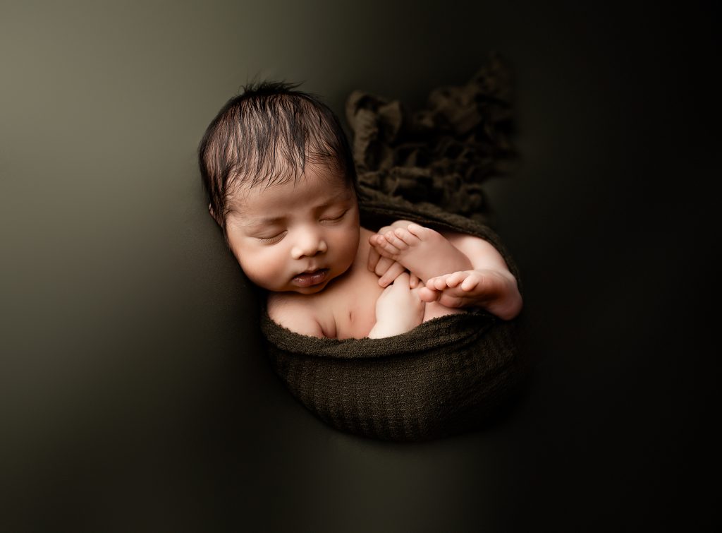 dark green newborn boy photo